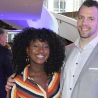 Two alumni pose for a photo together at the Chicago Alumni Reception